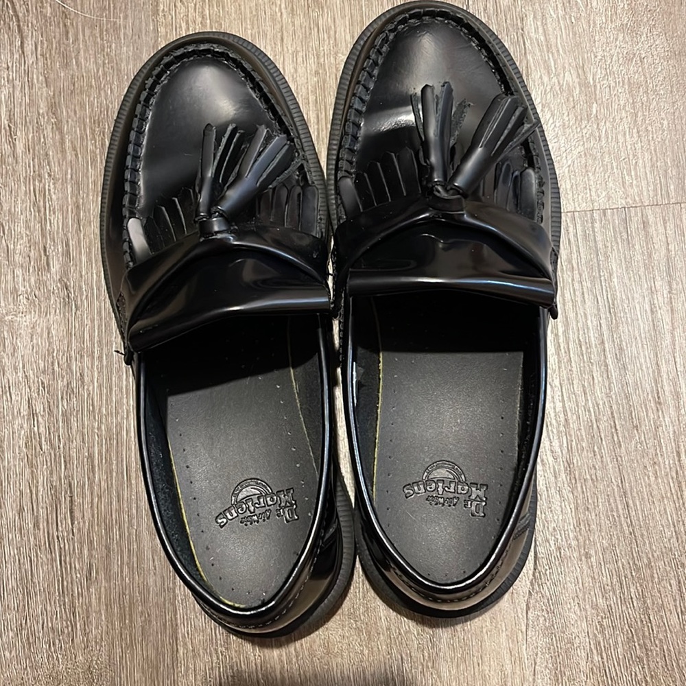 Womens Dr. Martens loafers with tassels.